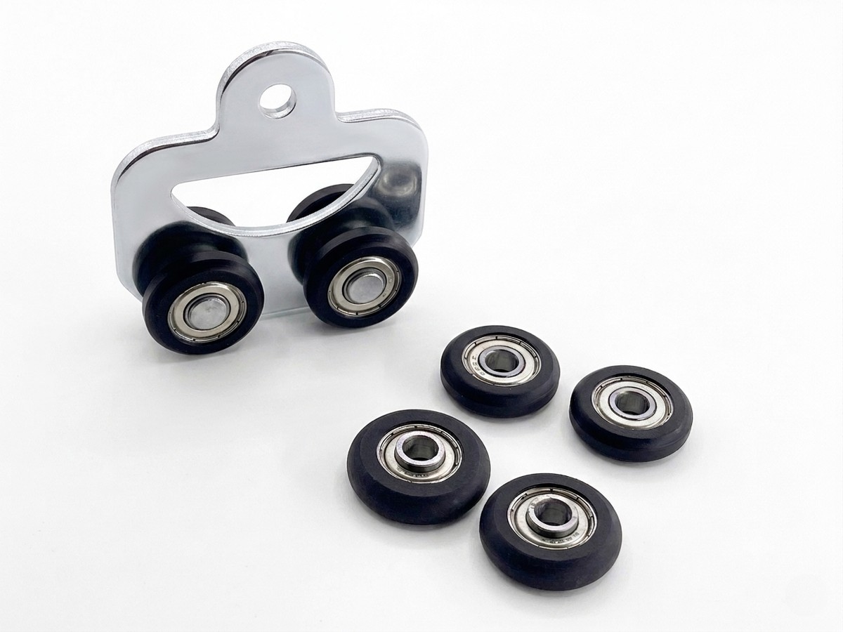 Sliding-door roller assembly with injection-molded wheels
