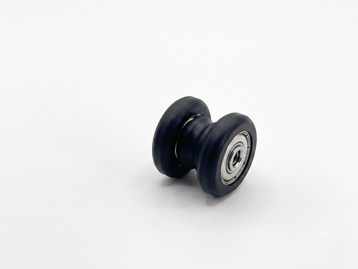 Injection-molded sliding-door roller wheel with bearing