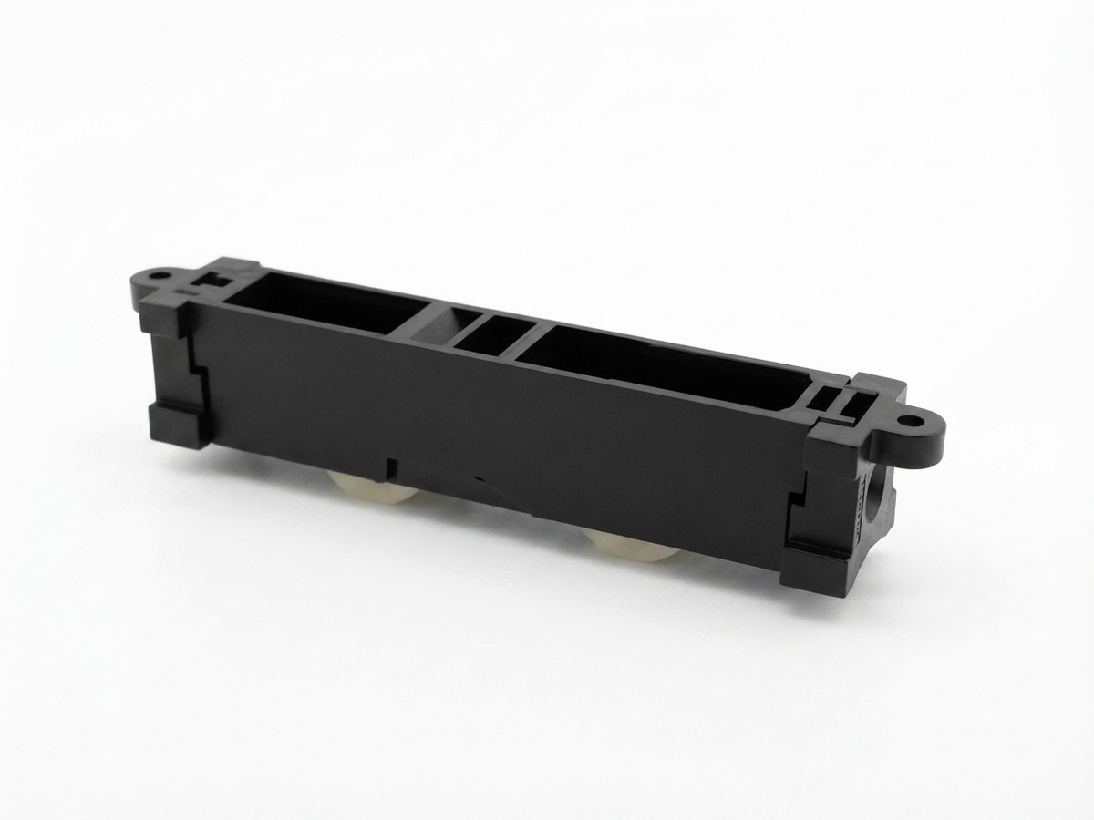 Injection-molded roller track bracket with dual wheels