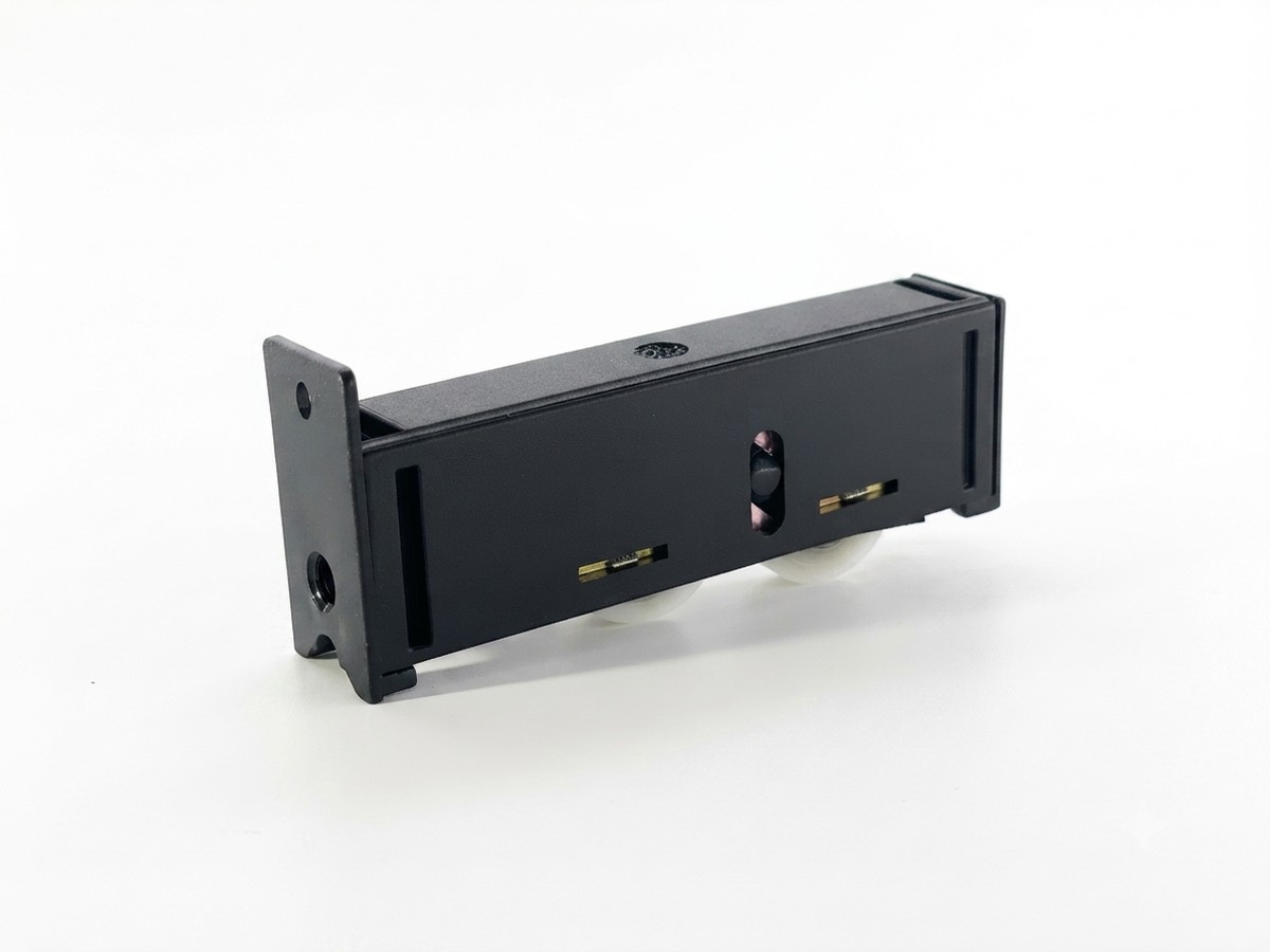 Injection-molded roller bracket with dowel pins