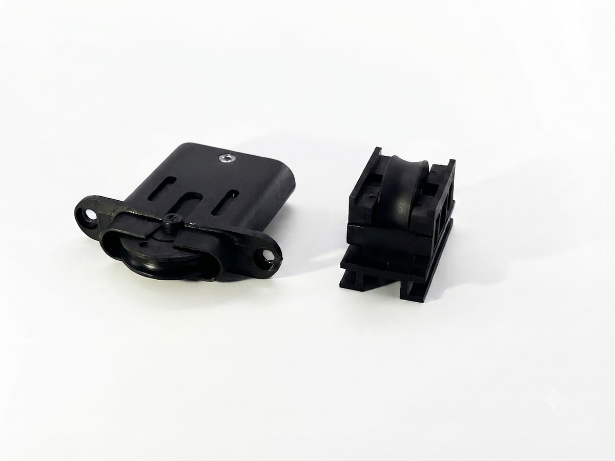 Injection-molded roller bracket with wheel housing, close-up