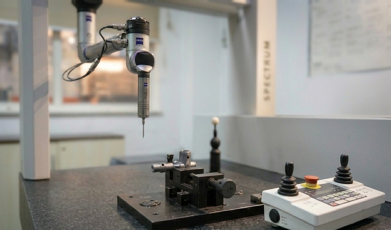 ZEISS coordinate measuring machine inspecting a fixtured precision part